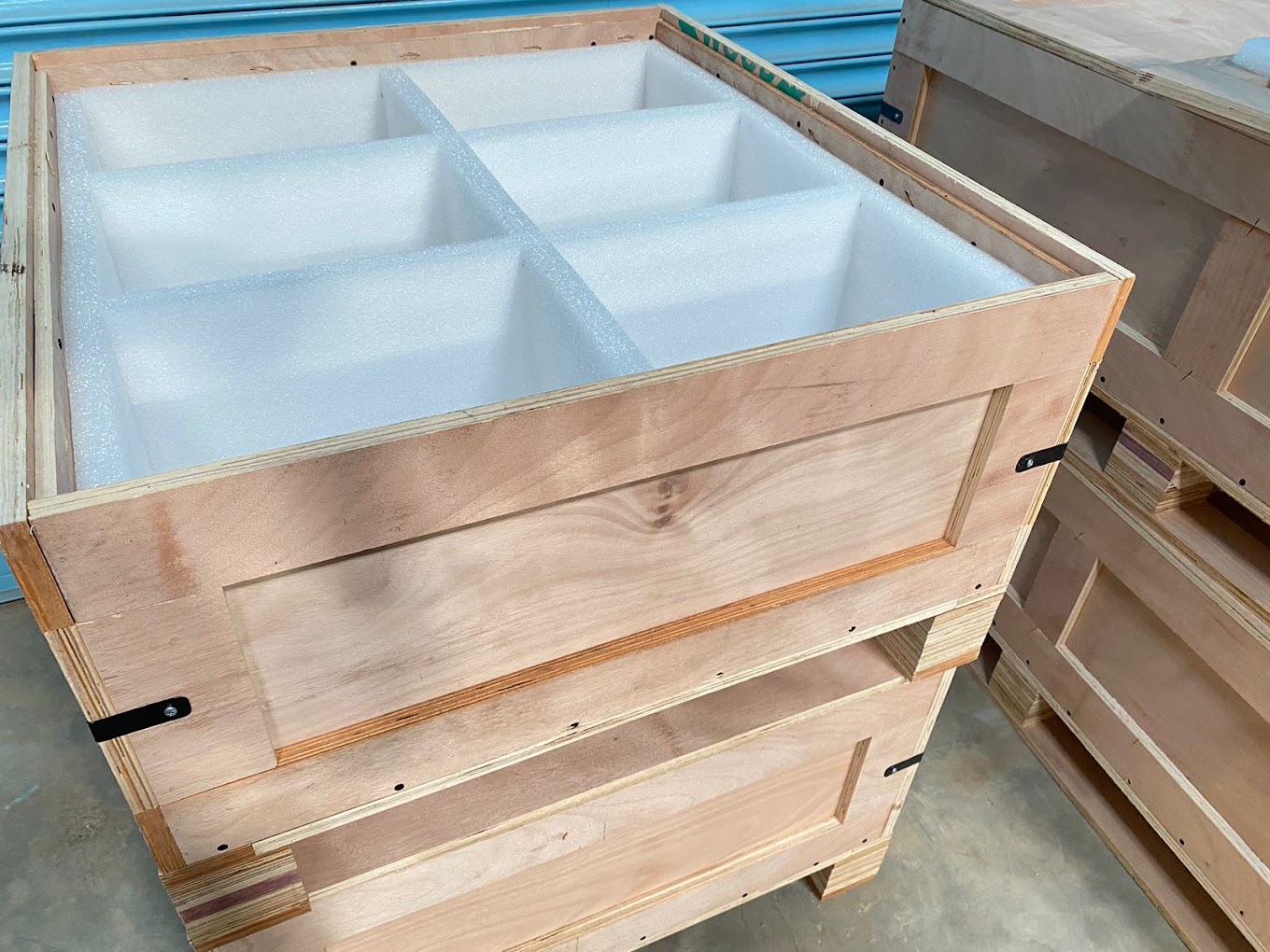 EPE foam grid nesting in plywood crate